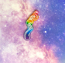 Load image into Gallery viewer, rainbow (pink, red, orange, yellow, green, blue, purple) curled tentacle earring with white outlines against a pink-and-blue nebula