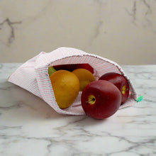 Load image into Gallery viewer, upcycled produce bag with fruit spilling out
