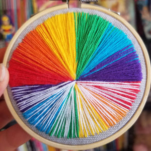 Hand embroidered rainbow landscape art hoop for LGBTQ pride month