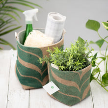 Load image into Gallery viewer, two burlap baskets, one filled with cleaning tools and the other with a green plant
