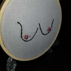 Hand embroidered flowers and boobs art hoop - pink