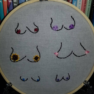 Hand embroidered flowers and boobs art hoop