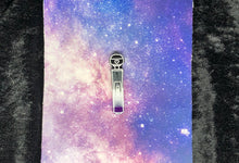 Load image into Gallery viewer, A hitachi magic wand earring with ace pride colors (black, grey, white, and purple) and bright white highlights on a pink-and-blue nebula and black crushed velvet background.
