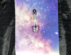 ace pride flag (black, gray, white, purple) spiked baseball bat earring with bright white outlines against a pink-and-blue nebula and black crushed velvet background