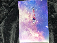 Load image into Gallery viewer, purple and pink spiked baseball bat earring with bright white outlines against a pink-and-blue nebula and black crushed velvet background
