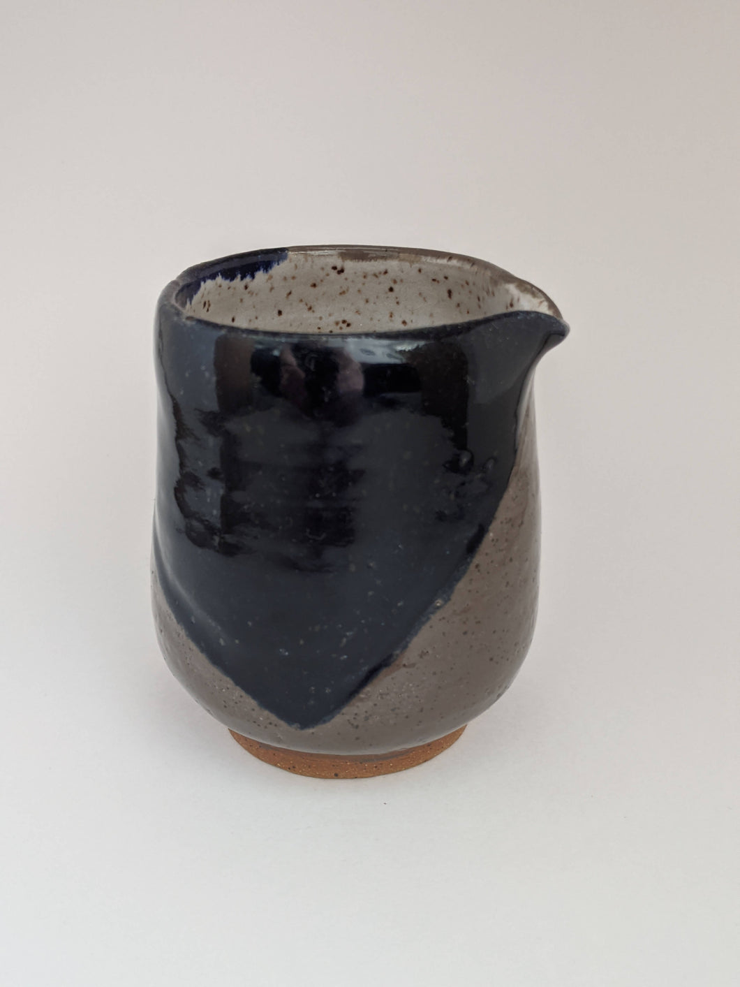 Speckled white, grey and navy Ceramic vessel with spout