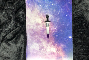ace pride flag (black, gray, white, purple) long sword earring with bright white outlines against a pink-and-blue nebula and black crushed velvet background